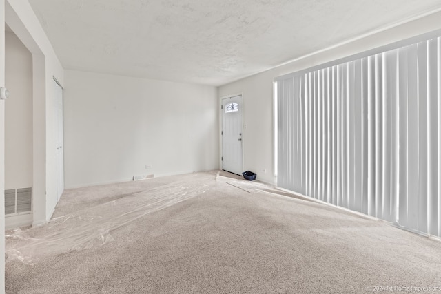 spare room with carpet floors