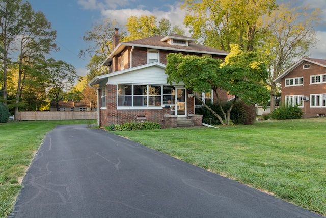 view of front of home with a front lawn