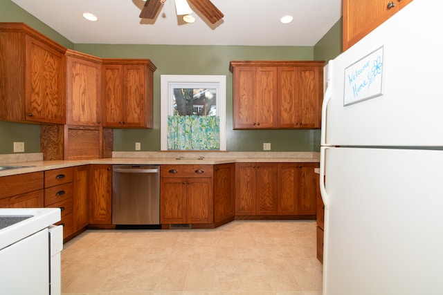 kitchen featuring white appliances and ceiling fan