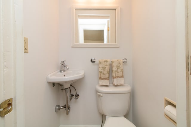 bathroom with sink and toilet