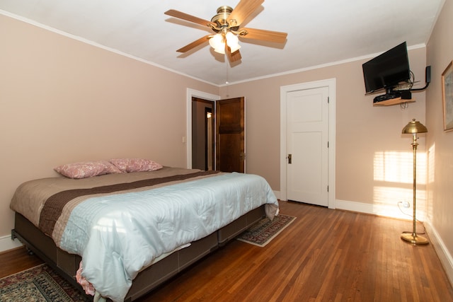 bedroom with crown molding, ceiling fan, and wood-type flooring