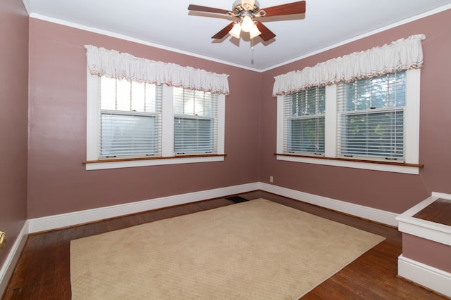 spare room with ceiling fan, crown molding, and dark hardwood / wood-style flooring