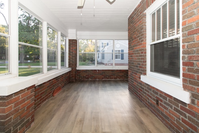 unfurnished sunroom featuring plenty of natural light