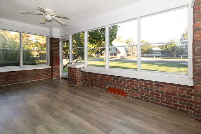 unfurnished sunroom with ceiling fan and a wealth of natural light