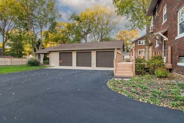 view of front facade featuring a deck and a garage