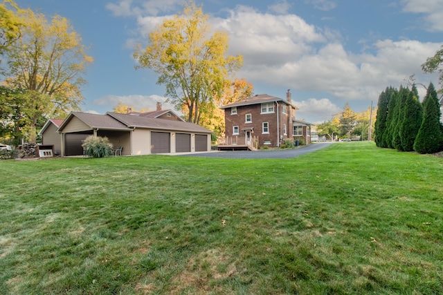 view of yard featuring a garage