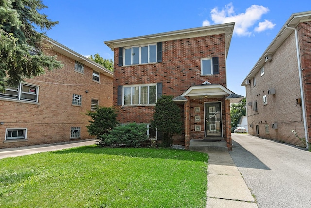 view of front of property with a front lawn