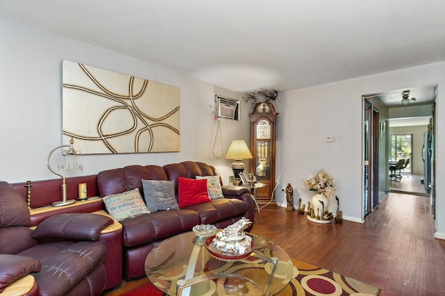 living room featuring hardwood / wood-style floors and a wall mounted AC