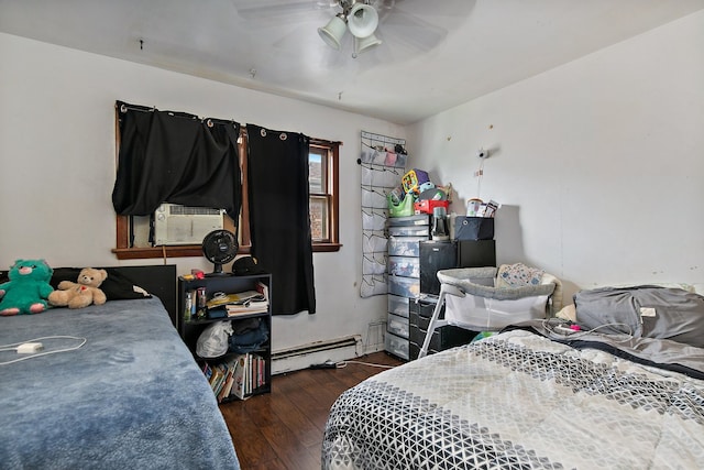 bedroom with ceiling fan, cooling unit, a baseboard radiator, and dark wood-type flooring