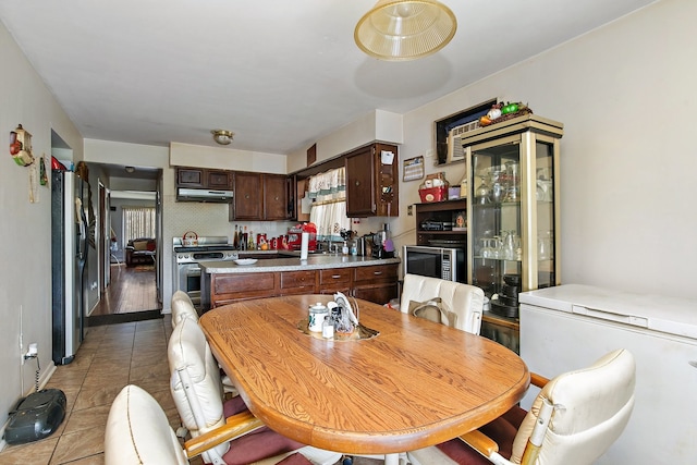 dining area featuring light wood-type flooring