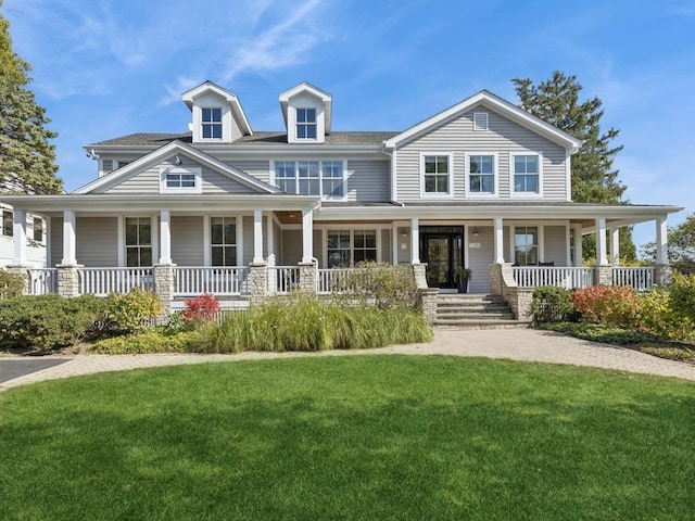 view of front of property featuring a porch and a front lawn