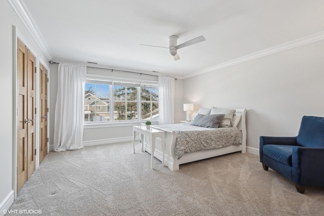 carpeted bedroom featuring ornamental molding and ceiling fan