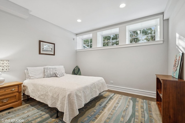 bedroom featuring dark hardwood / wood-style flooring