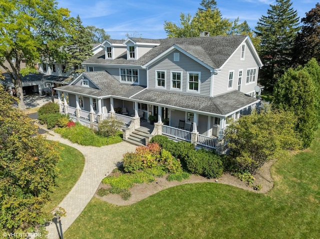 view of front facade featuring a porch and a front yard