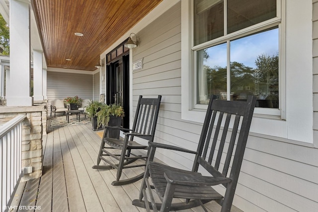 wooden terrace featuring a porch