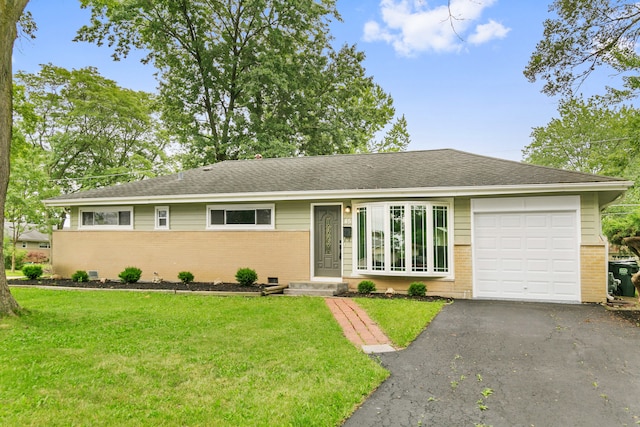 single story home with a garage and a front yard