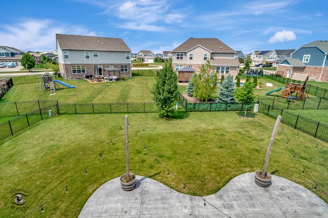 view of yard with a playground and a patio