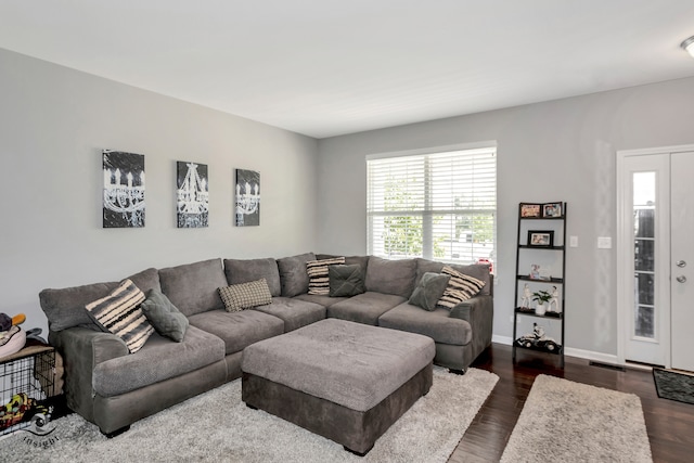 living room with dark hardwood / wood-style floors