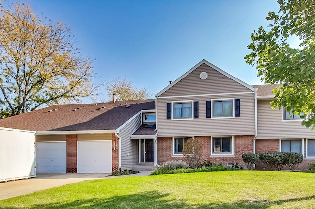 view of front of property with brick siding, a shingled roof, a front lawn, concrete driveway, and a garage