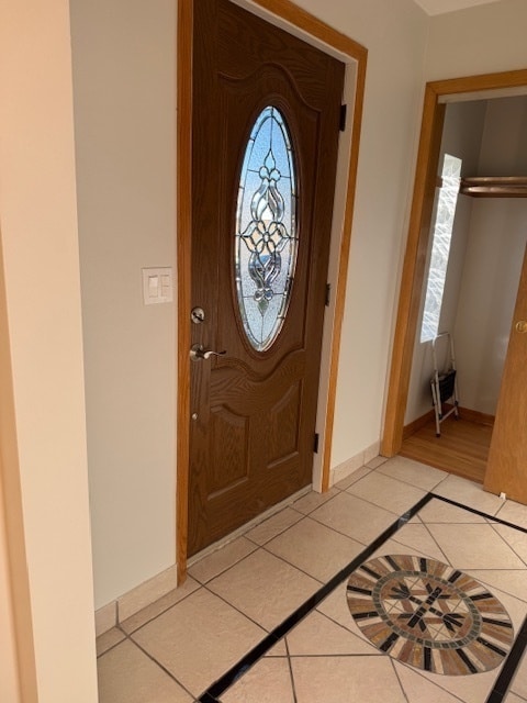 entrance foyer with light tile patterned floors