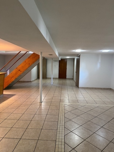 basement with light tile patterned floors