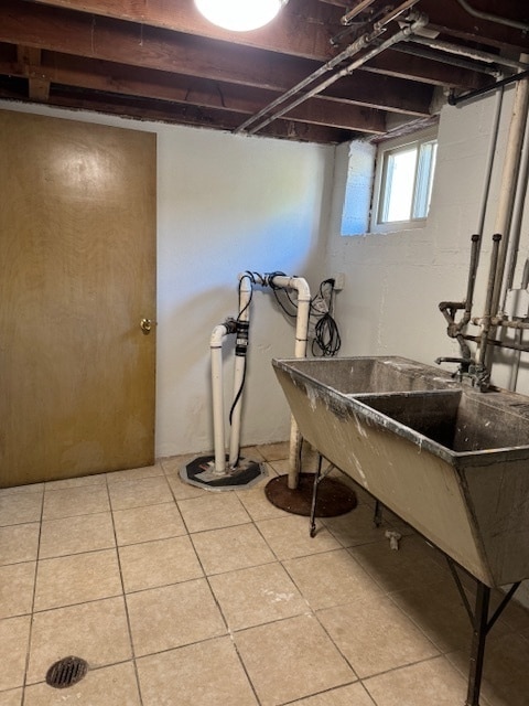 basement with light tile patterned flooring