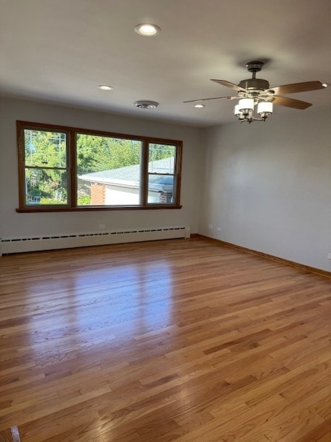 unfurnished room featuring light wood-type flooring and plenty of natural light