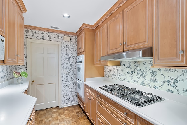 kitchen with ornamental molding, light parquet flooring, extractor fan, stainless steel gas stovetop, and white double oven