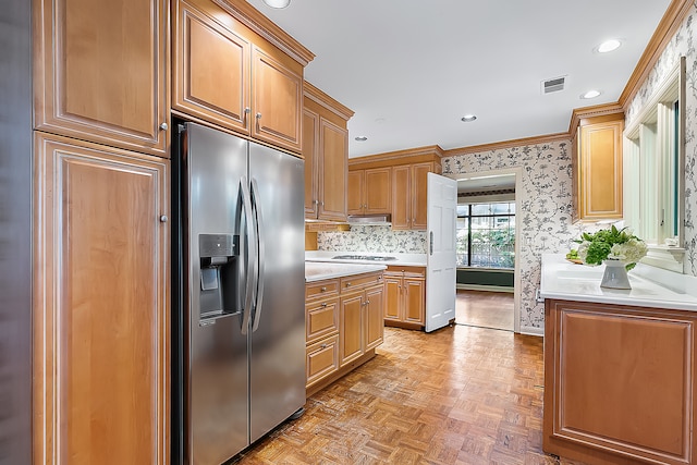 kitchen with white gas stovetop, tasteful backsplash, ornamental molding, stainless steel fridge with ice dispenser, and light parquet flooring