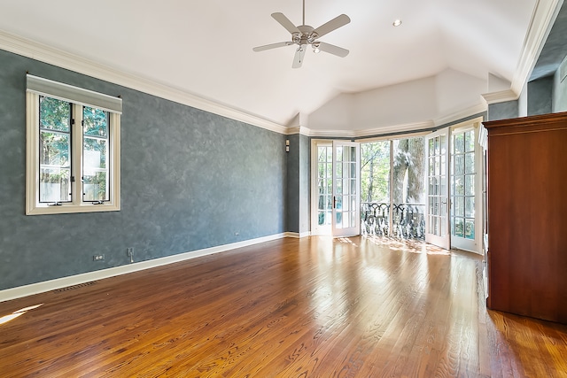 spare room featuring vaulted ceiling, hardwood / wood-style flooring, a wealth of natural light, and ceiling fan