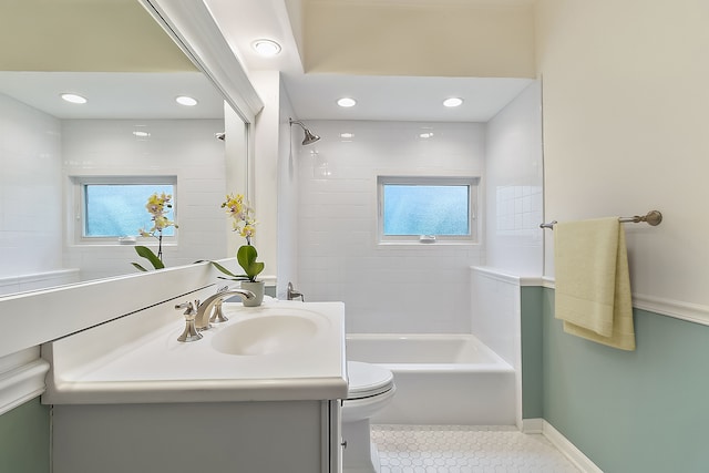 full bathroom with vanity, tiled shower / bath combo, toilet, and tile patterned floors