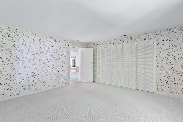 unfurnished bedroom with carpet flooring