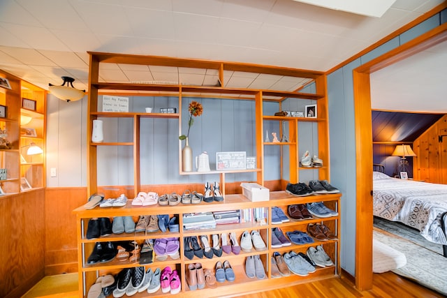 interior space featuring wood walls and light hardwood / wood-style flooring