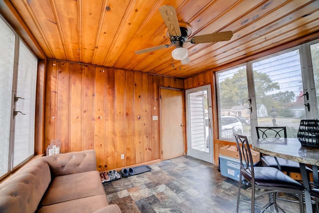 sunroom / solarium with ceiling fan and wood ceiling