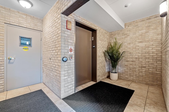 doorway to property featuring elevator