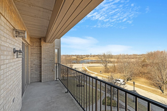 balcony featuring a water view