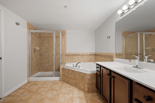 full bathroom featuring vanity, a shower stall, a garden tub, and tile patterned floors