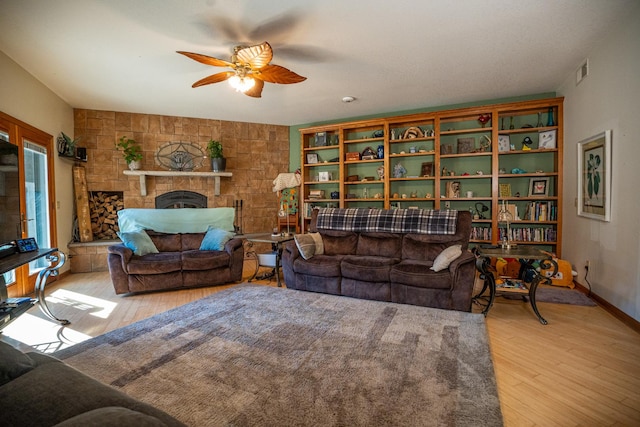 802 Union Rd, Harmon, IL 61042 - living area featuring wood finished floors, ceiling fan, a fireplace, and baseboards