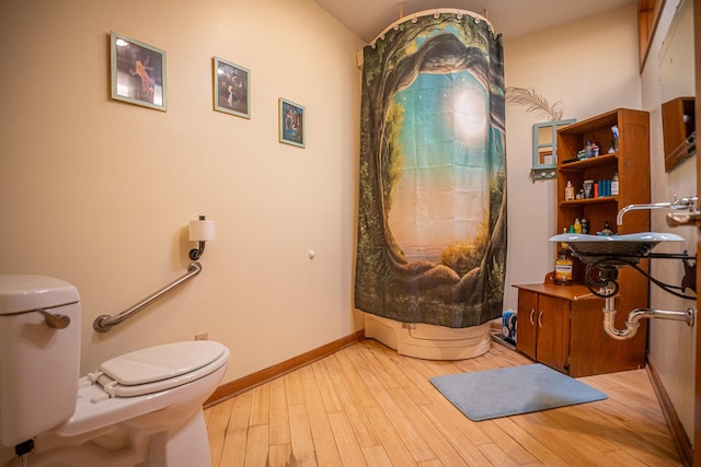 802 Union Rd, Harmon, IL 61042 - full bathroom with toilet, wood finished floors, and baseboards