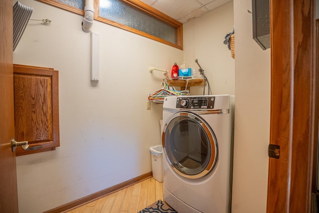 802 Union Rd, Harmon, IL 61042 - laundry room featuring washer / clothes dryer, light wood-style floors, and baseboards
