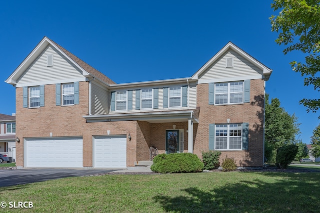 view of front facade featuring a front yard and a garage