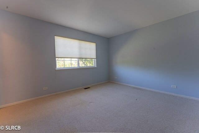 empty room featuring carpet floors