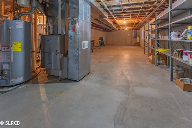 basement with gas water heater and heating unit