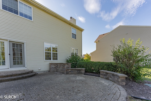 back of property with a patio area