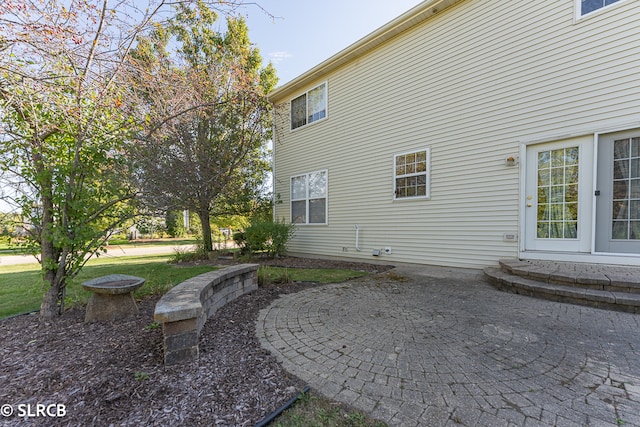 exterior space featuring a lawn and a patio