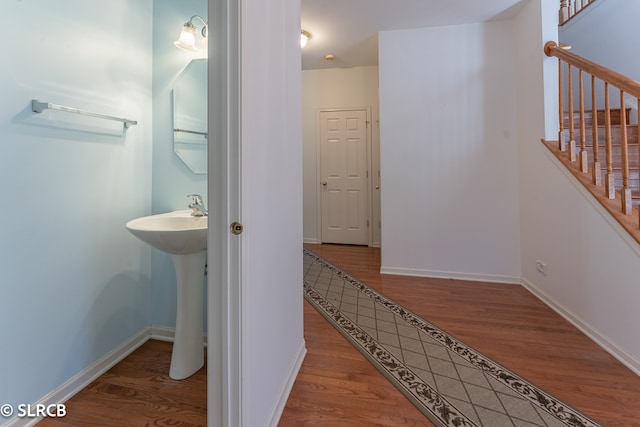 corridor with wood-type flooring