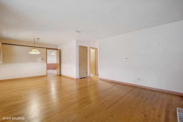 1087 Cedar Ln, Northbrook, IL 60062 - spare room featuring light wood-type flooring and baseboards