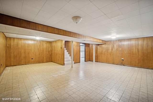 1087 Cedar Ln, Northbrook, IL 60062 - finished below grade area with wood walls, tile patterned floors, and stairway