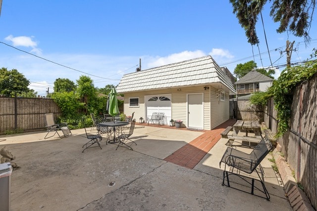 view of patio / terrace featuring an outbuilding