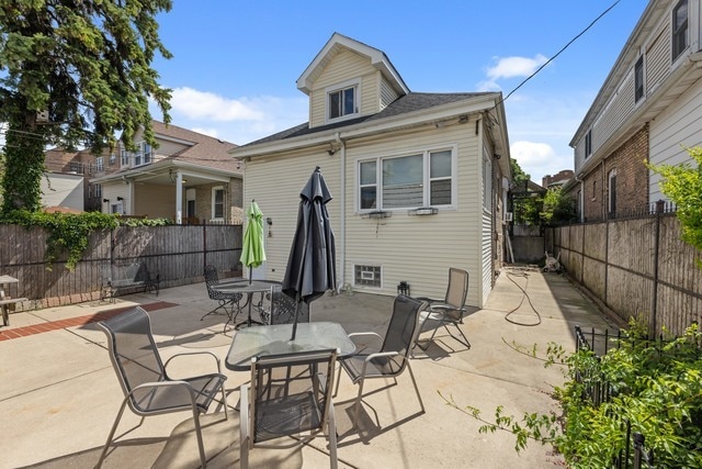 rear view of house featuring a patio